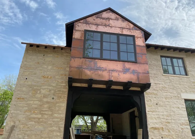 Copper metal panel facade on a stone building for Metal Roof Coating in Orange Park